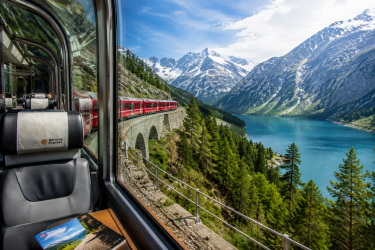 Panoramic train journey through the Italian and Swiss Alps, including the Bernina Express and other iconic scenic rail experiences curated across Northern Italy.