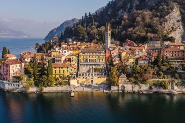Colorful waterfront of Varenna on Lake Como served by MC Eurodriver's luxury chauffeur service.